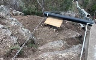 lowering pipes down cliff